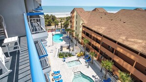 A hotel with multiple swimming pools, outdoor seating, and a view of the beach. - Peaceful Cabana Section*Indoor/Outdoor Pools*Mc61 (Myrtle Beach)