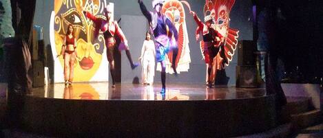 A stage with performers in traditional costumes.