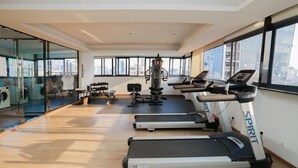 A gym with treadmills, weights, and a rowing machine. - Aurea Central Hotel (Phnom Penh)
