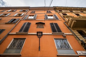 Stunning building with a unique orange facade and traditional architecture.
