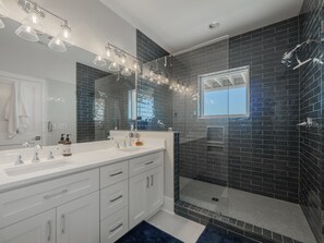 Shower, hair dryer, towels, toilet paper