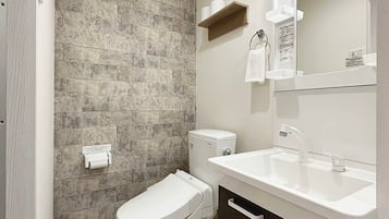 Bathtub, hair dryer, towels
