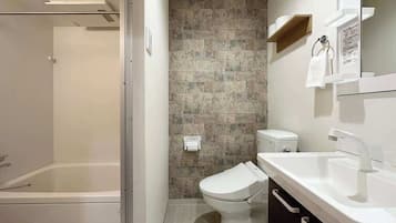 Bathtub, hair dryer, towels