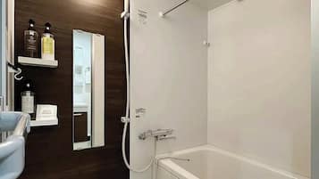 Bathtub, hair dryer, towels, soap