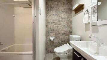 Bathtub, hair dryer, towels, soap