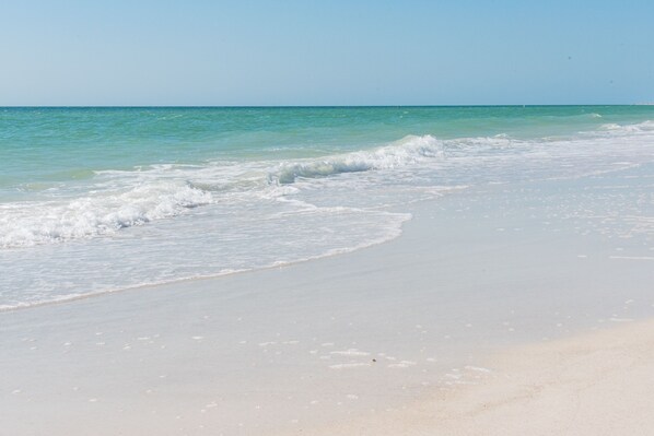 On the beach, sun loungers, beach towels
