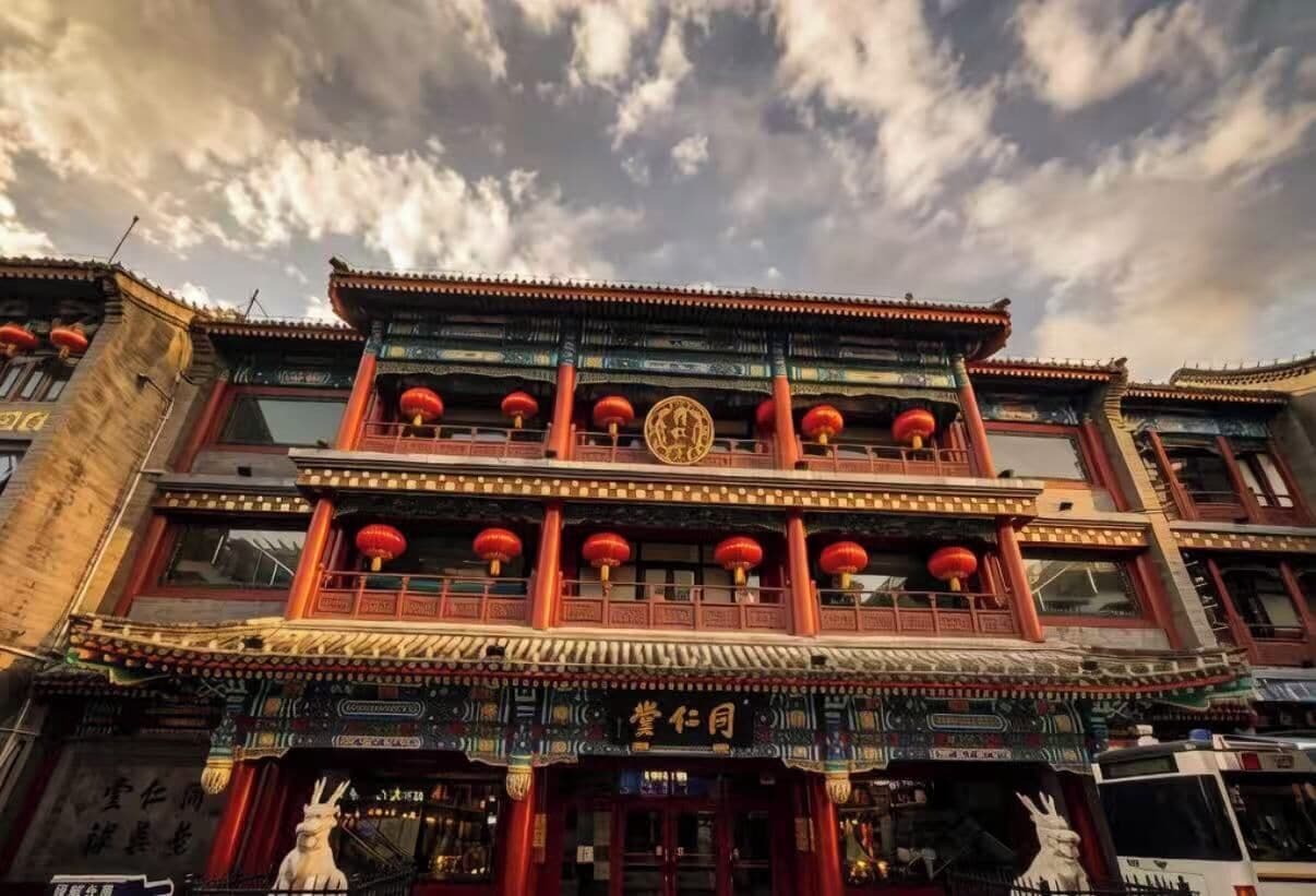 A traditional building with multiple balconies, ornate decorations, and a prominent entrance.
