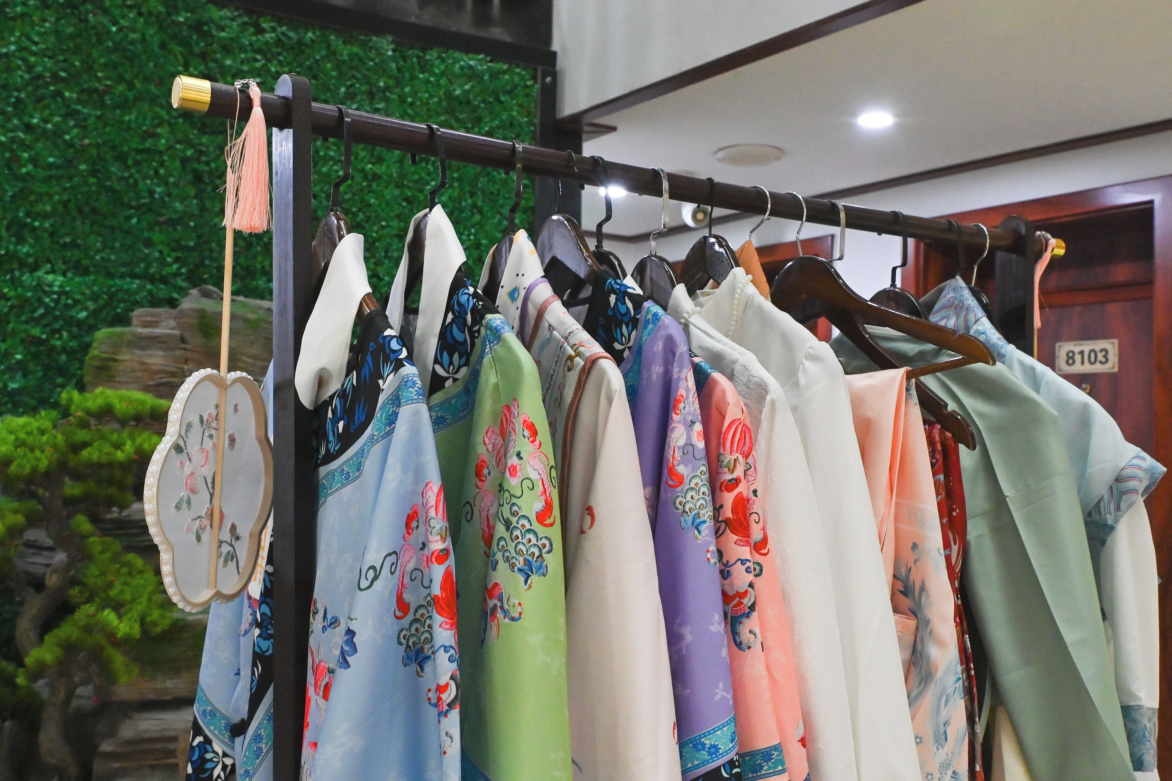 A clothing rack with various garments.
