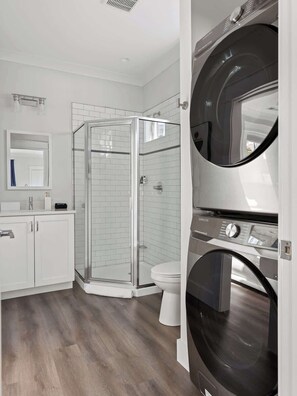 Shower, hair dryer, towels, shampoo