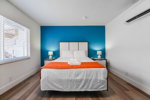 1 bedroom, desk, iron/ironing board, travel crib