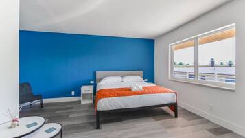 1 bedroom, desk, iron/ironing board, travel crib