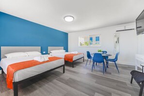 1 bedroom, desk, iron/ironing board, travel crib