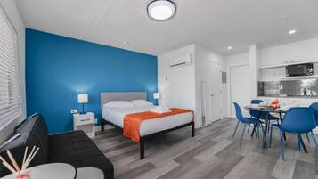 1 bedroom, desk, iron/ironing board, travel crib