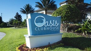 A sign for Oasis Clubhouse at ChampionsGate. - 5 Star Villa With 9 Bedrooms, Orlando Villa 4227 (Davenport)