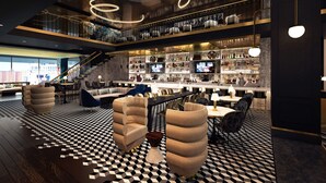 A modern bar area with a checkered floor, seating, and a bar stocked with bottles. - Renaissance New York Harlem Hotel (New York)
