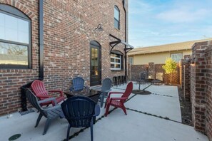 Outdoor dining - Historic Pensacola, a new warehouse inspired home. (Pensacola)