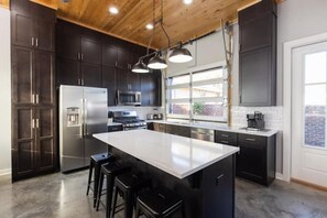 Fridge, microwave, oven, stovetop - Historic Pensacola, a new warehouse inspired home. (Pensacola)