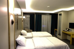 Habitación triple Premium | Wifi gratis y ropa de cama 