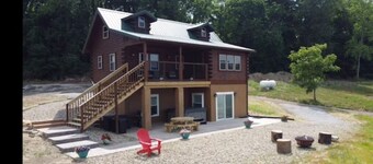 Log Cabin on a private 18 acre lake, with a hot tub, kayaks and fishing.  