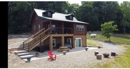 Log Cabin on a private 18 acre lake, with a hot tub