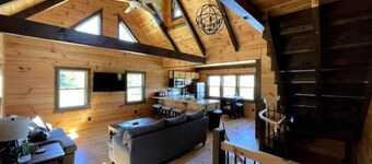 Log Cabin on a private 18 acre lake, with a hot tub, kayaks and fishing.  