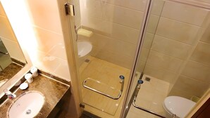 A modern bathroom with a glass shower enclosure, a marble sink, and a toilet. - Greentree Inn Bengbu Huaiyuan County Yudu Avenue Xinhe Road Express Hotel (Bengbu)