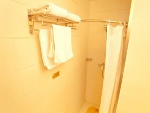 A bathroom with a shower, a towel rack with folded towels, and a visible shower control panel. - Greentree Alliance Nanjing Hanzhongmeng Subway Station Hotel (Nanjing)