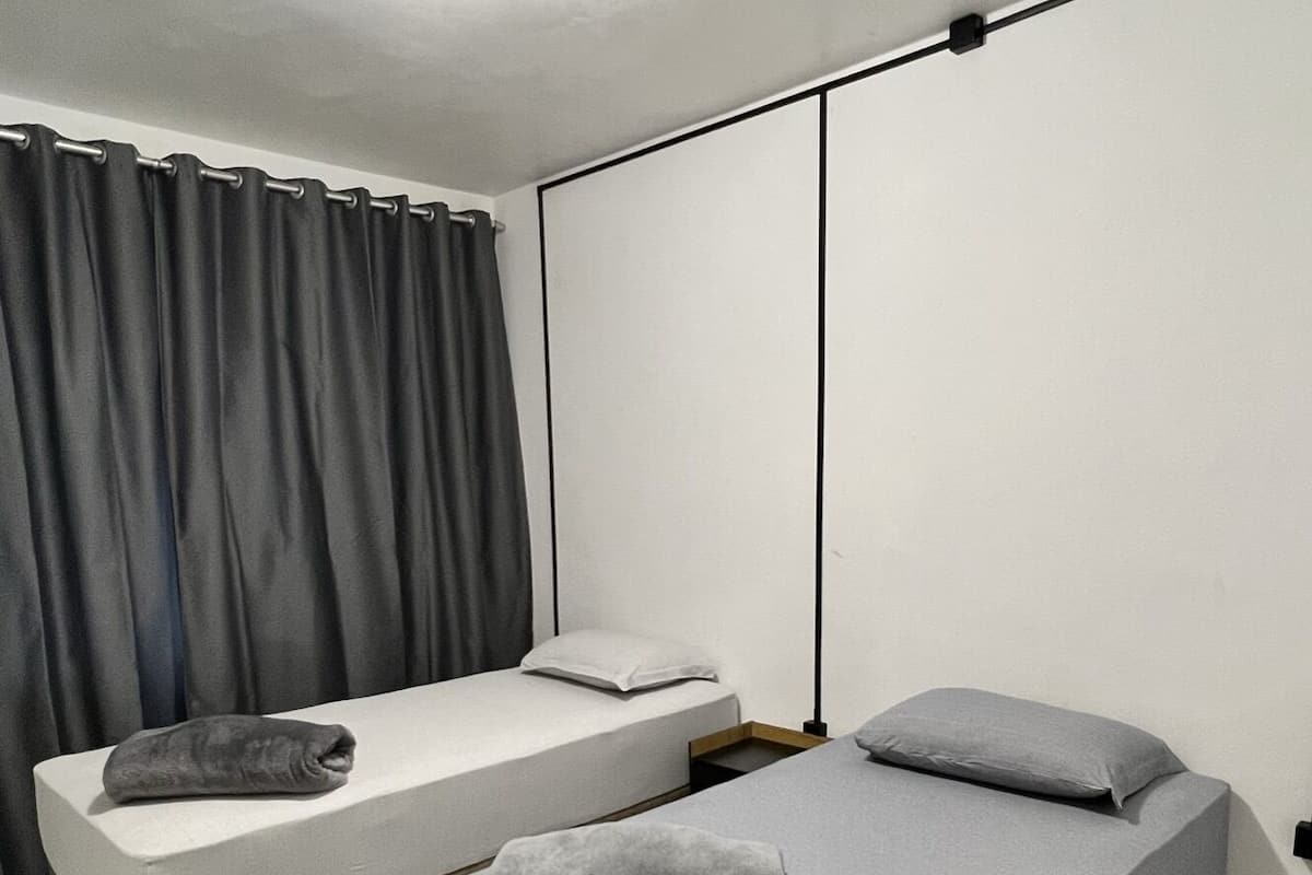 1 bedroom, premium bedding, blackout curtains, soundproofing