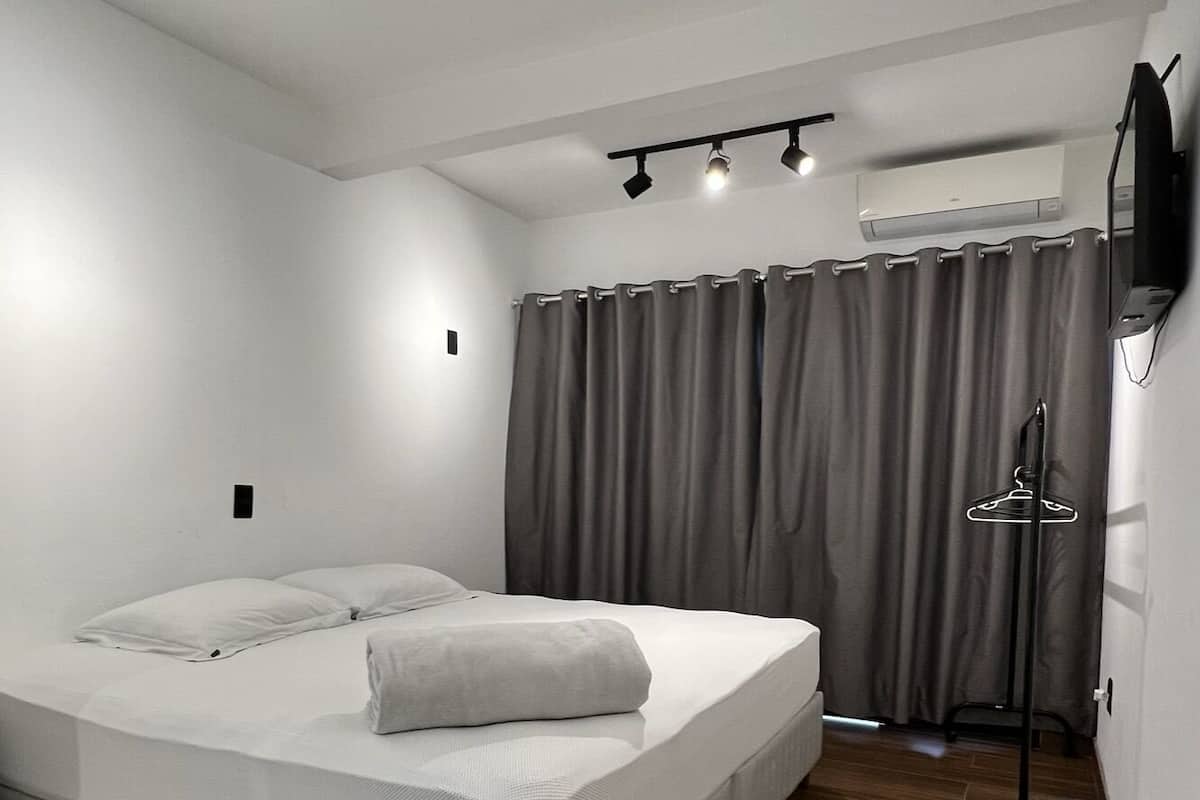 1 bedroom, premium bedding, blackout curtains, soundproofing