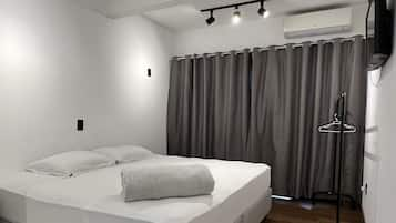 Premium bedding, blackout curtains, soundproofing, iron/ironing board