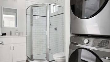 Shower, hair dryer, towels, shampoo