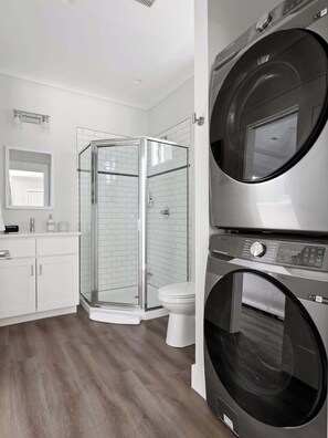 Shower, hair dryer, towels, shampoo