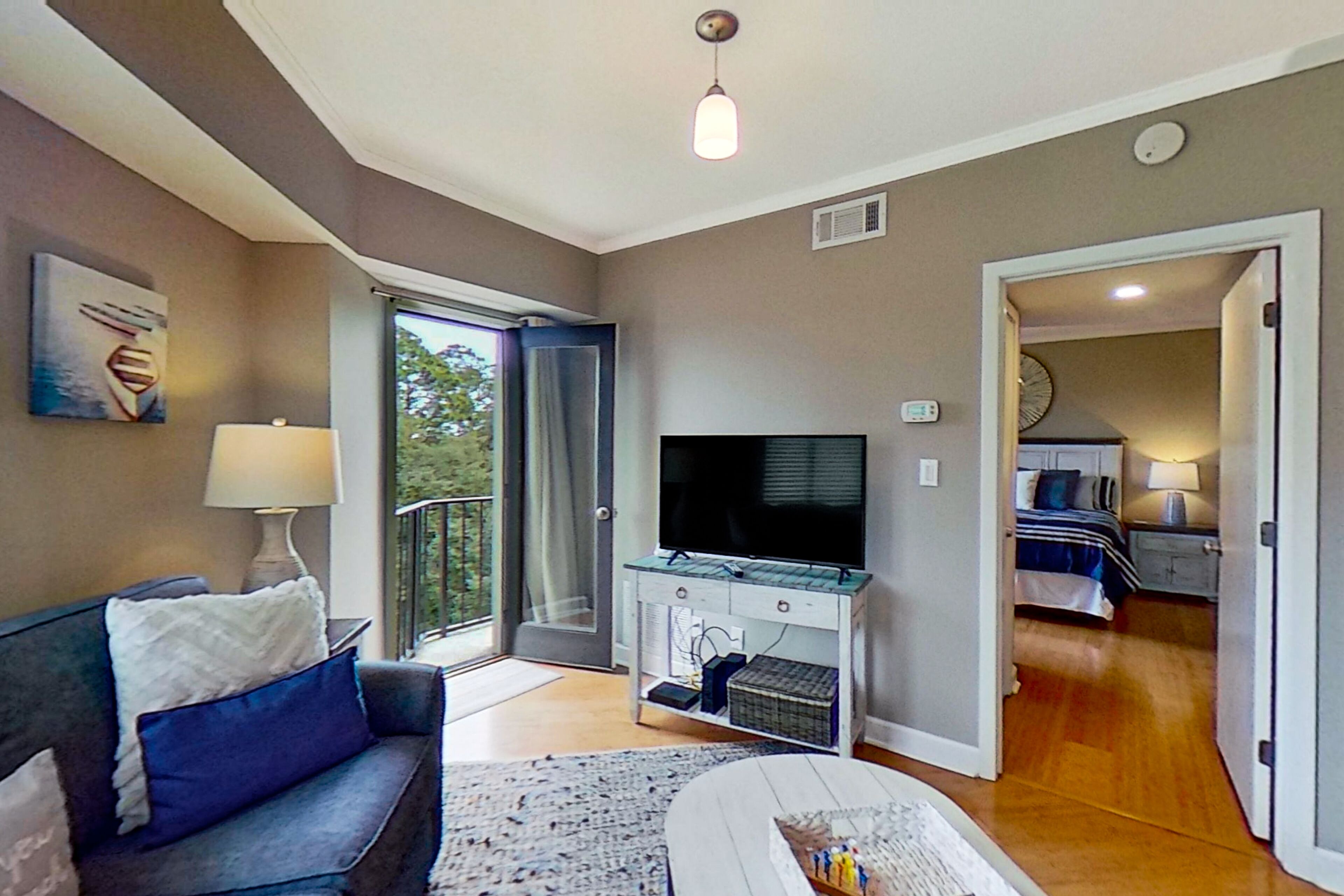 Coastal condo with pool, tennis court, balcony, & central AC - perfect location