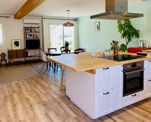 A modern kitchen with a wooden island, white cabinetry, and a built-in oven. - Chez Georges - House 3 - Lakes and Gorges du Verdon (ESPARRON DE VERDON)