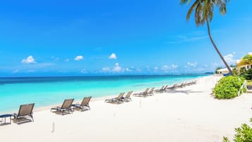 On the beach, sun loungers, beach towels