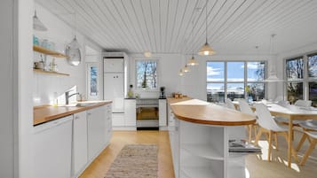 Fridge, stovetop, dishwasher, coffee/tea maker