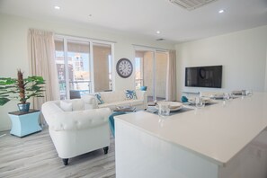 Design Apartment | Living area | 70-inch Smart TV with cable channels, TV, streaming services