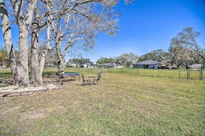 Relax in a serene outdoor space with a picnic table and chairs.