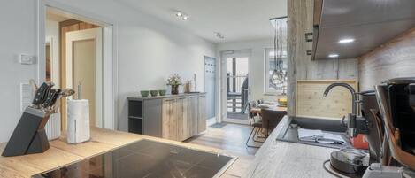 Fridge, stovetop, dishwasher, coffee/tea maker