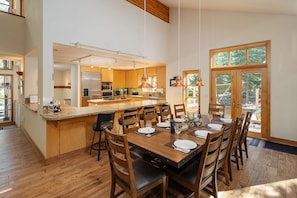 A spacious kitchen with wooden cabinets, a central island, and pendant lighting. - 4 Bedroom Northstar World Class Mountain Resort - Ski, Hike, Bike, Wi-Fi! (Truckee)