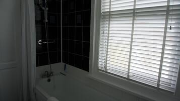 Combined shower/bathtub, deep-soaking bathtub, hair dryer, towels