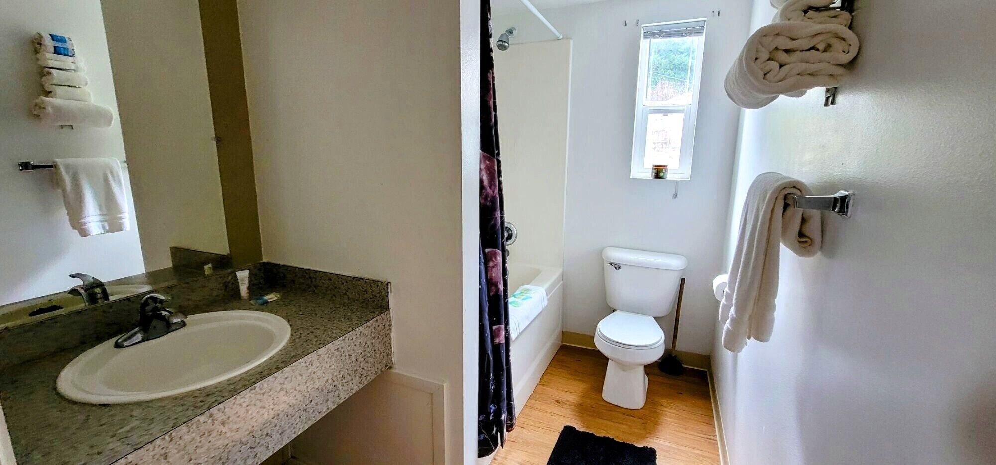 Een badkamer met een wastafel, toilet en douche.