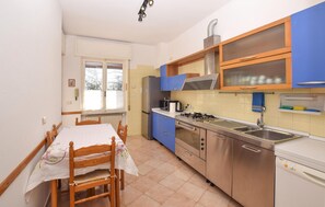 Fridge, stovetop, dishwasher, coffee/tea maker