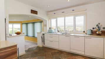 Fridge, electric kettle, toaster, cookware/dishes/utensils