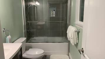 Shower, hair dryer, towels, soap