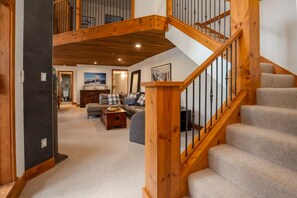 Relax in this inviting living area with a leather sofa and wooden coffee table.