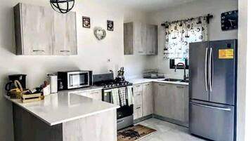 Coffee/tea maker, fridge, microwave, oven