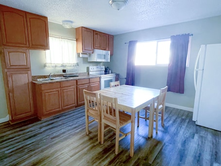 Suite 2 King 1 Queen | Private kitchen | Mini-fridge, microwave, coffee/tea maker, cookware/dishes/utensils. Studio 9 Fort Bragg, LLC.