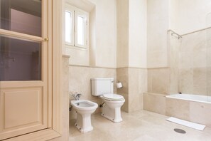 Bathtub, hair dryer, towels, soap