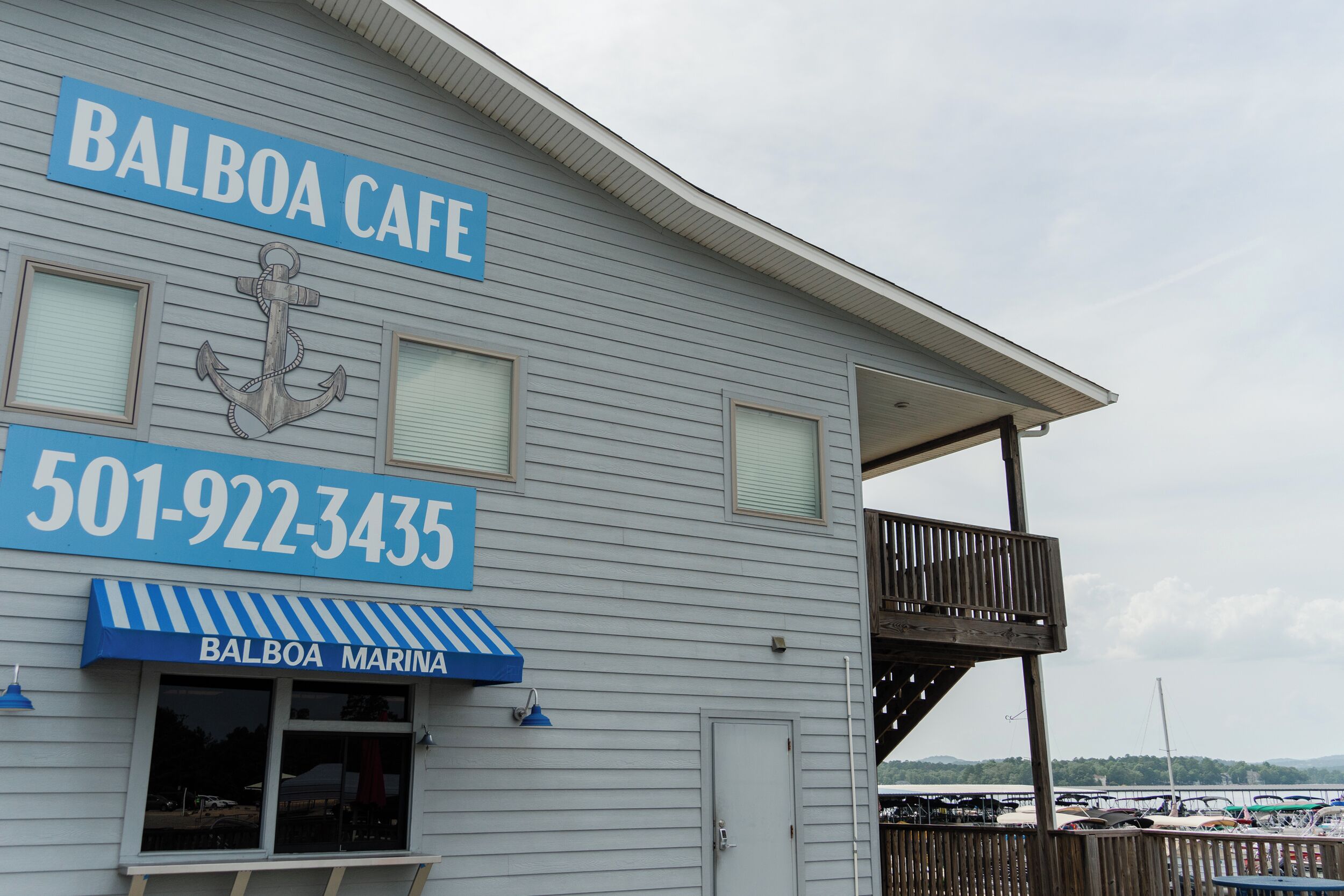 A building with a sign reading "Balboa Cafe" and a phone number "501-922-3435".
